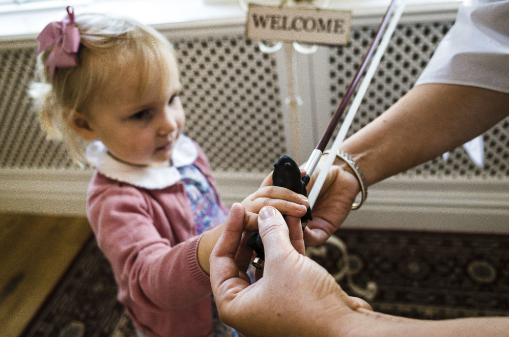 Girl with welcome sign in the background